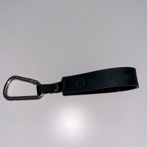 Lululemon black silicone key chain.